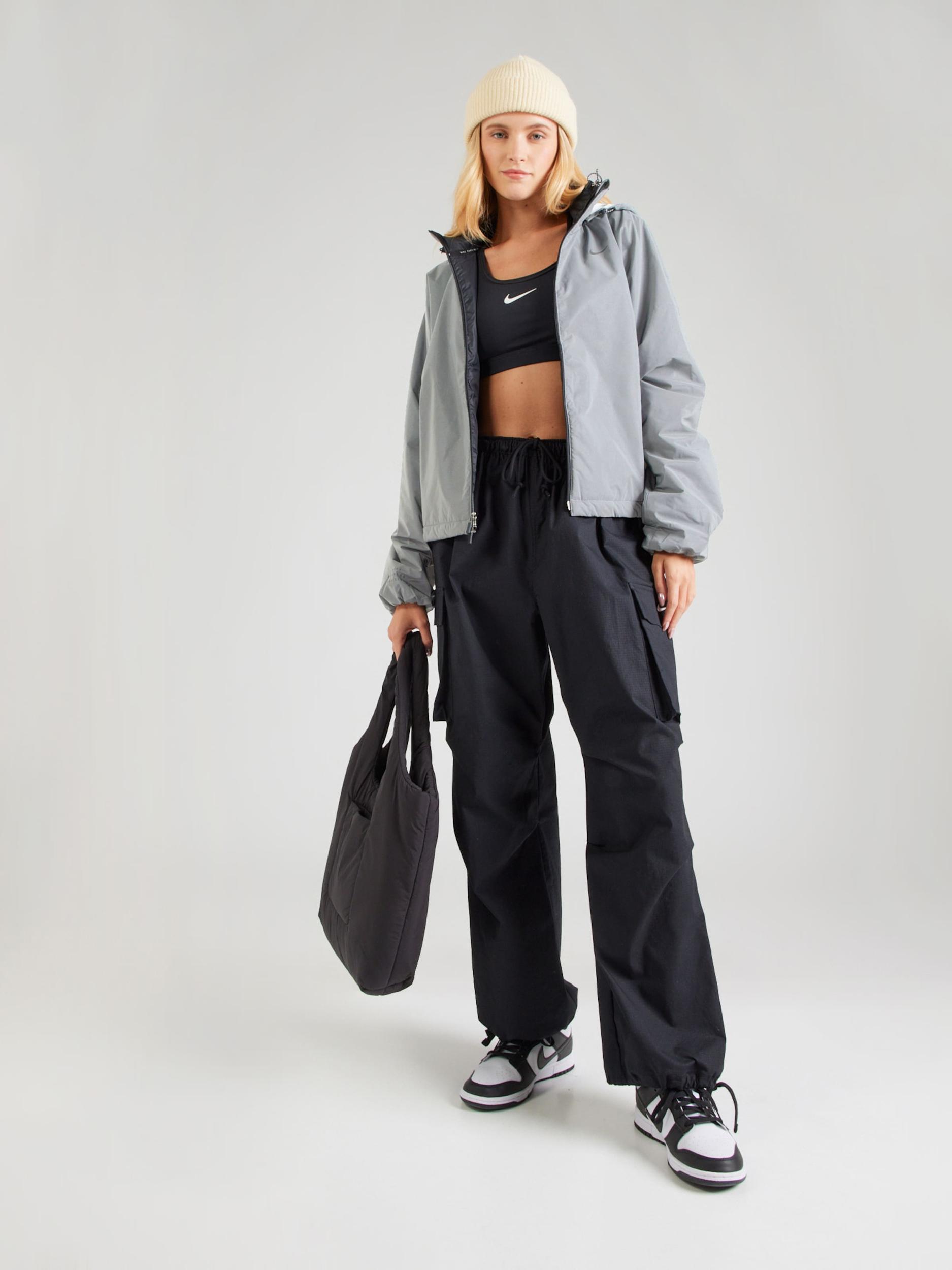 Nike Sportswear Prehodna jakna 'DVN' srebrno-siva / črna