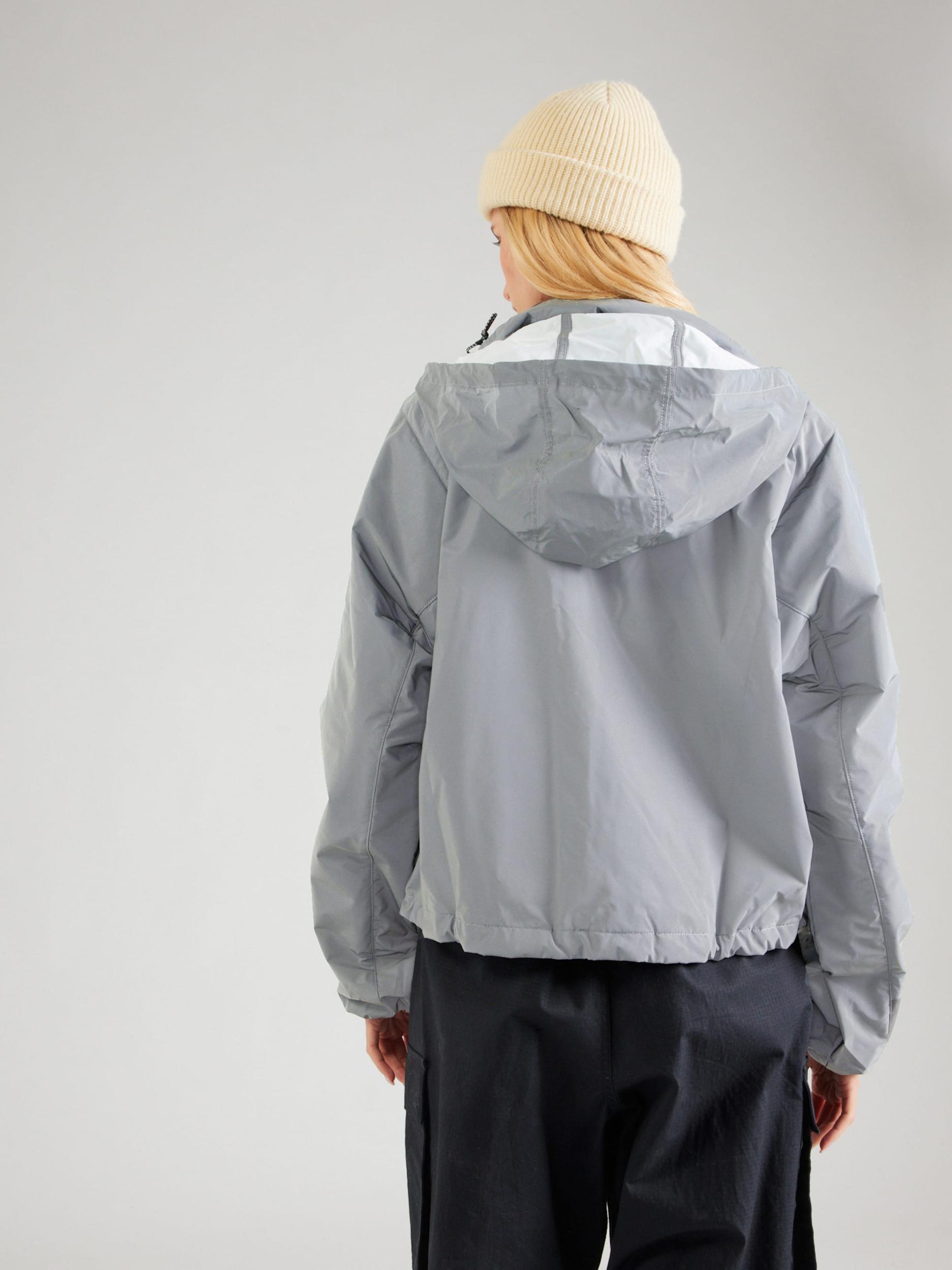 Nike Sportswear Prehodna jakna 'DVN' srebrno-siva / črna