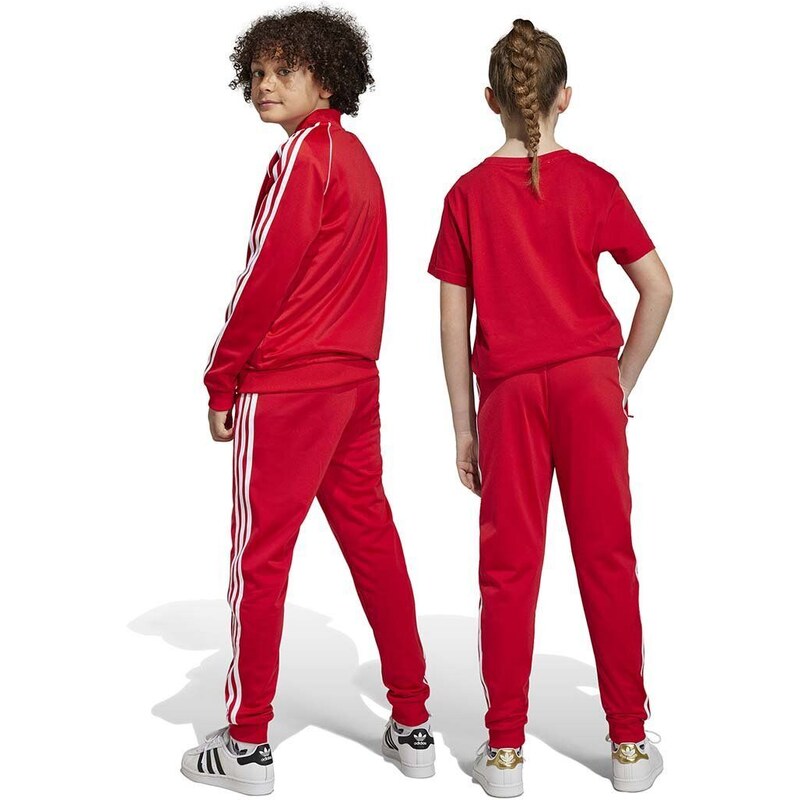 Otroški spodnji del trenirke adidas Originals rdeča barva